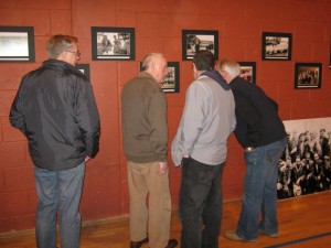 Dockers look at pictures from the Preservation Society's magnificent collection in Sheriff Street Youth Centre on Saturday night